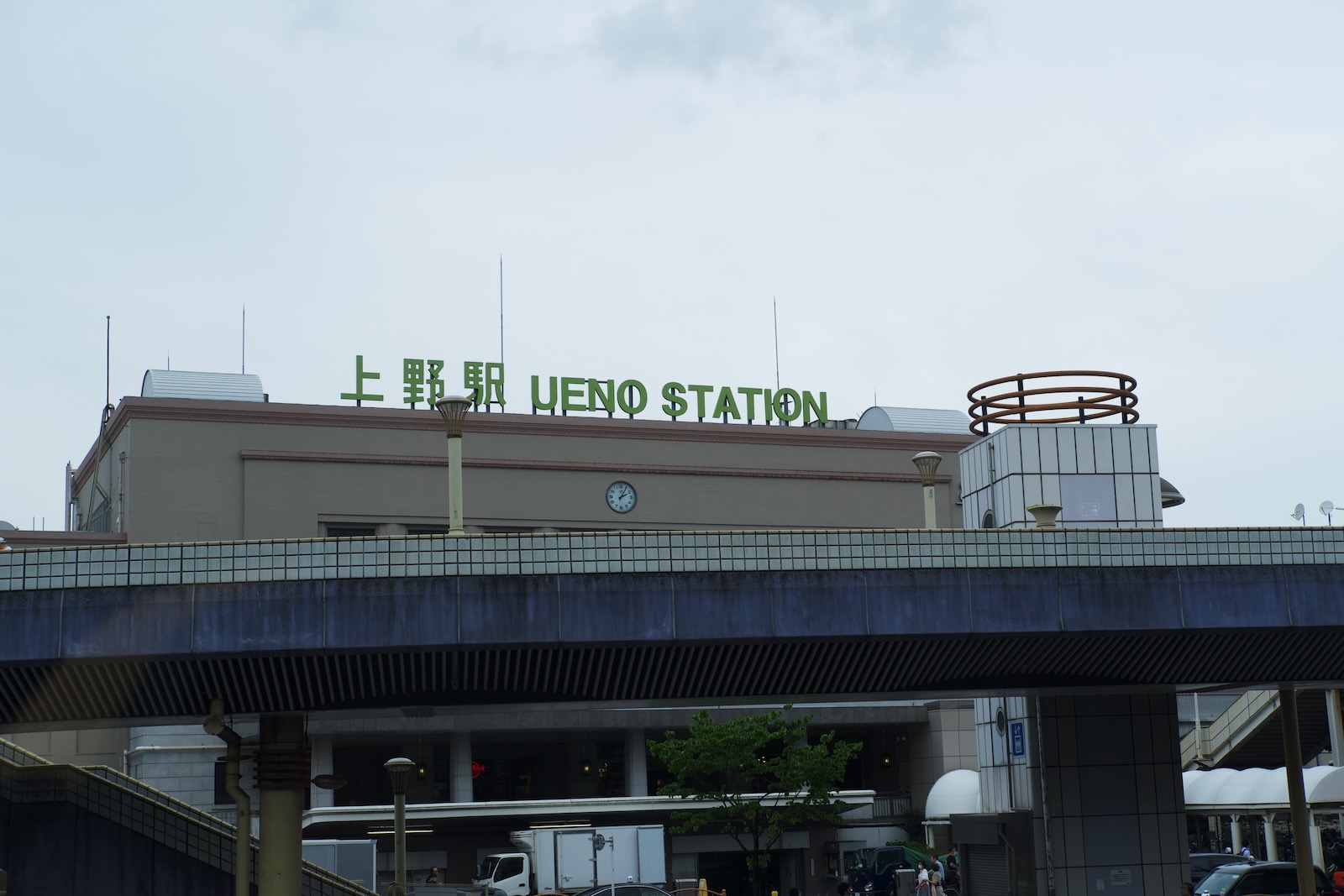 Green sign atop Ueno rail station.